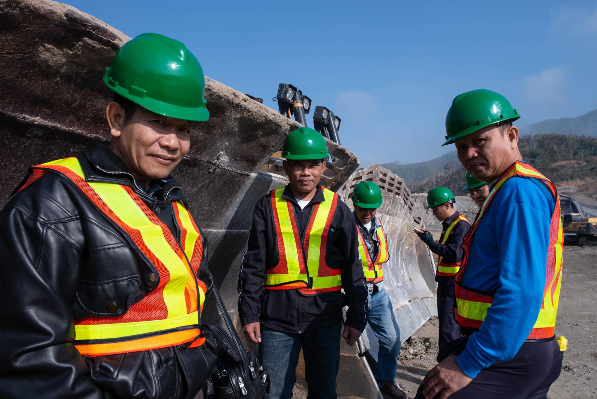 Damming The Mekong River - Lao construction workers at the Xayaburi Dam construction...