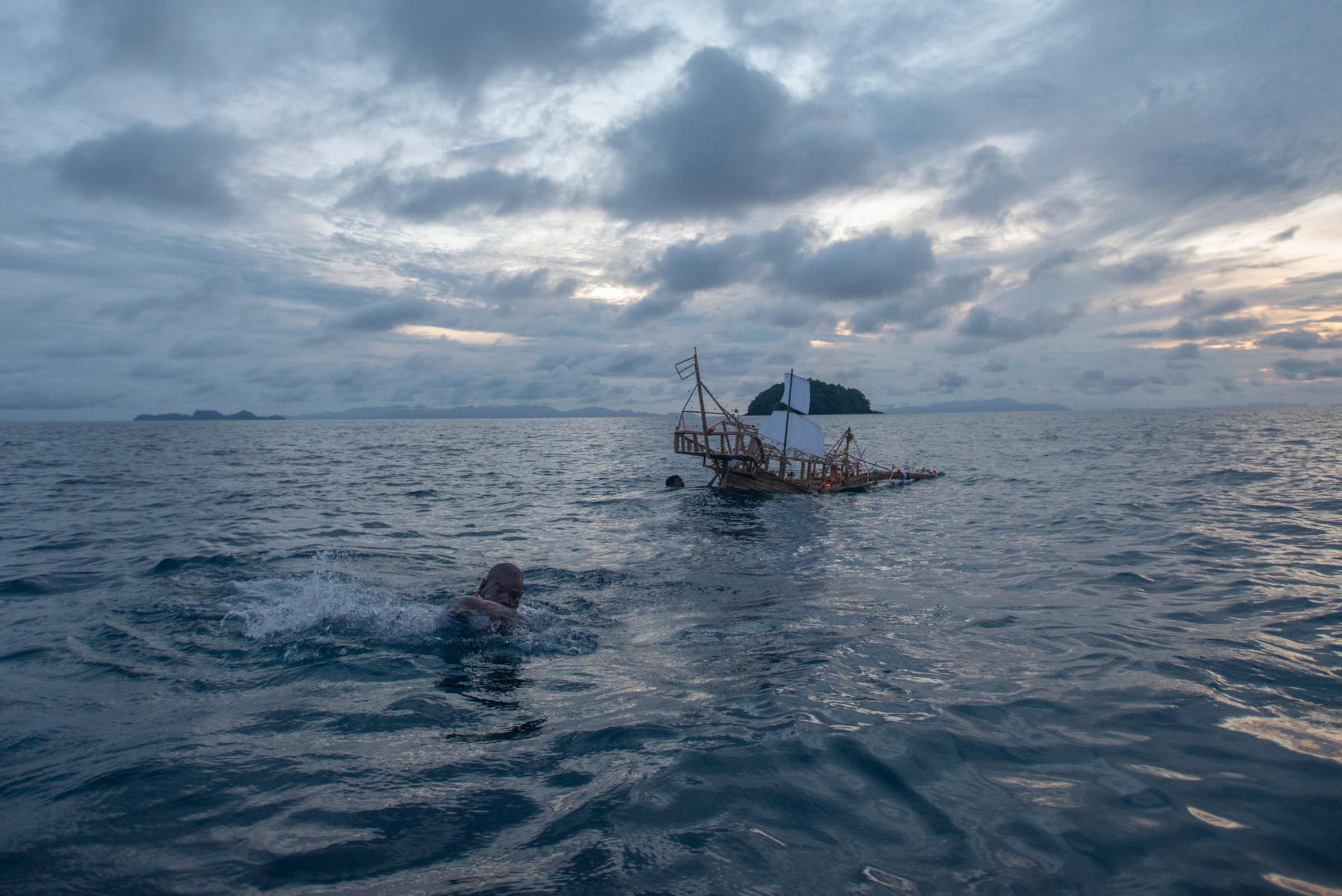 Lipe Island - A native gypsy swims back to the boat after floating a...