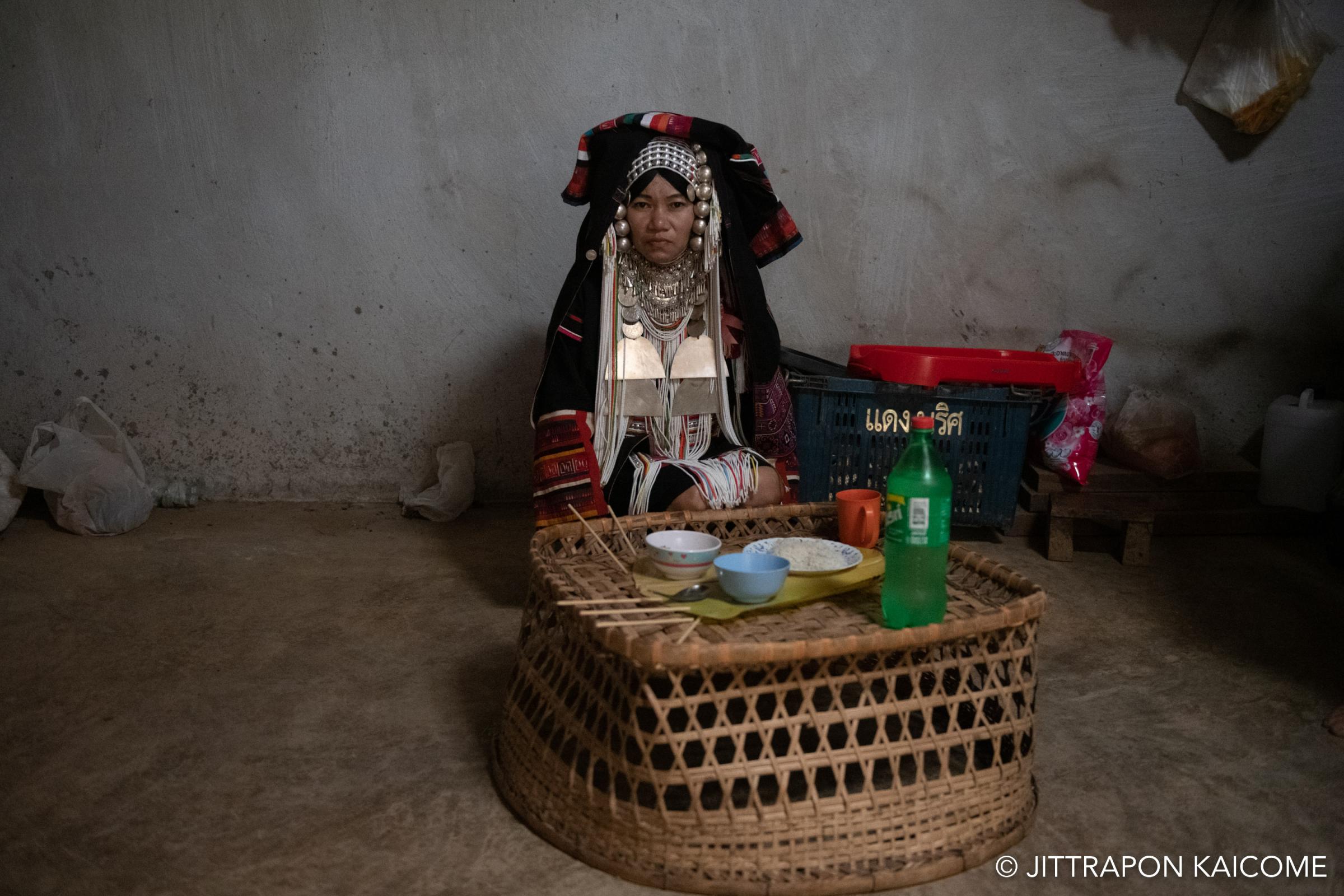 People  - A bride from the Akha tribe is served a special meal...
