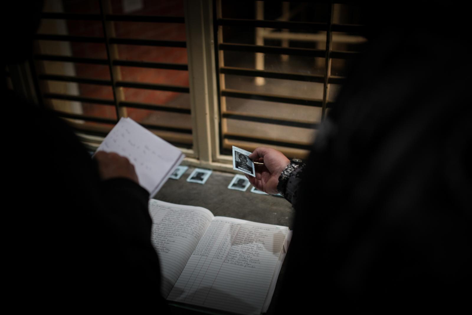 A guard holds a photograph of a...in Bogot&aacute;, Colombia.