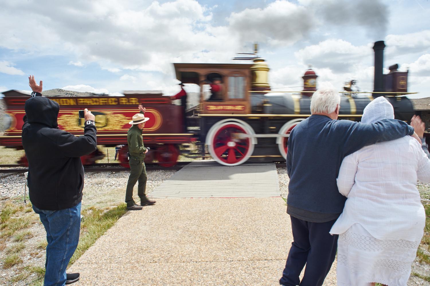 The Weird, Wonderful--and Dying--Great Salt Lake - Visitors watch a re-enactment involving replica trains used in the transcontinental railroad at...