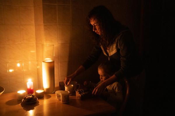 Image from Ukraine Goes Dark - Olha Kovalova, 30, refugee from Kharkiv, preparing tea...