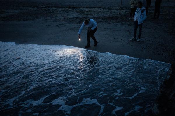 Image from Ukraine Goes Dark - Odesa residents spending time near the Black sea in...