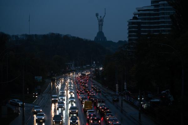 Image from Ukraine Goes Dark - Cars lighting the way without street lights in Kyiv on...
