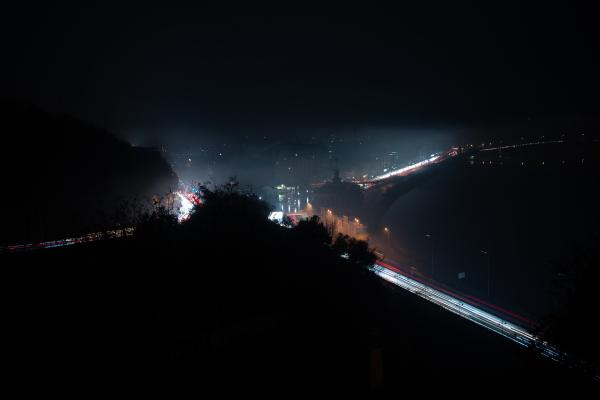 Image from Ukraine Goes Dark - Cars lighting the way without street lights in Kyiv on...