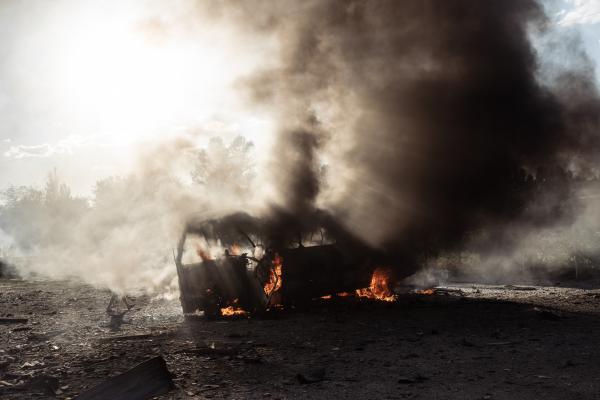 Image from Russian-Ukrainian War - The civilian bus is burning. In the evening of July 23,...