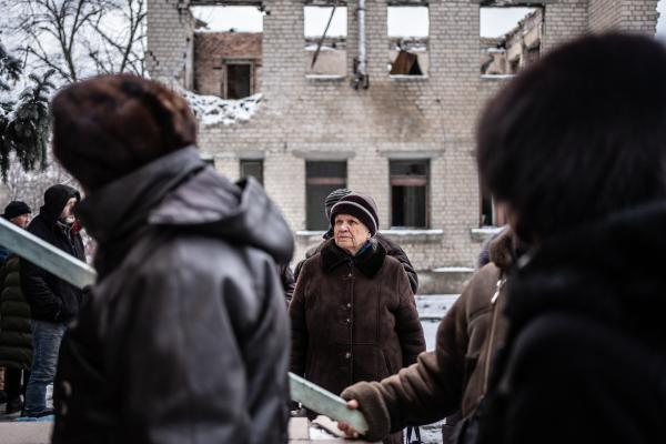 Image from Russian-Ukrainian War - People waiting in line for the warm lunch provided by...