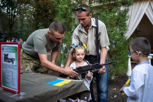 Image from The New Symphony of Donbas - The girl wearing a traditional Ukrainian headband posing...