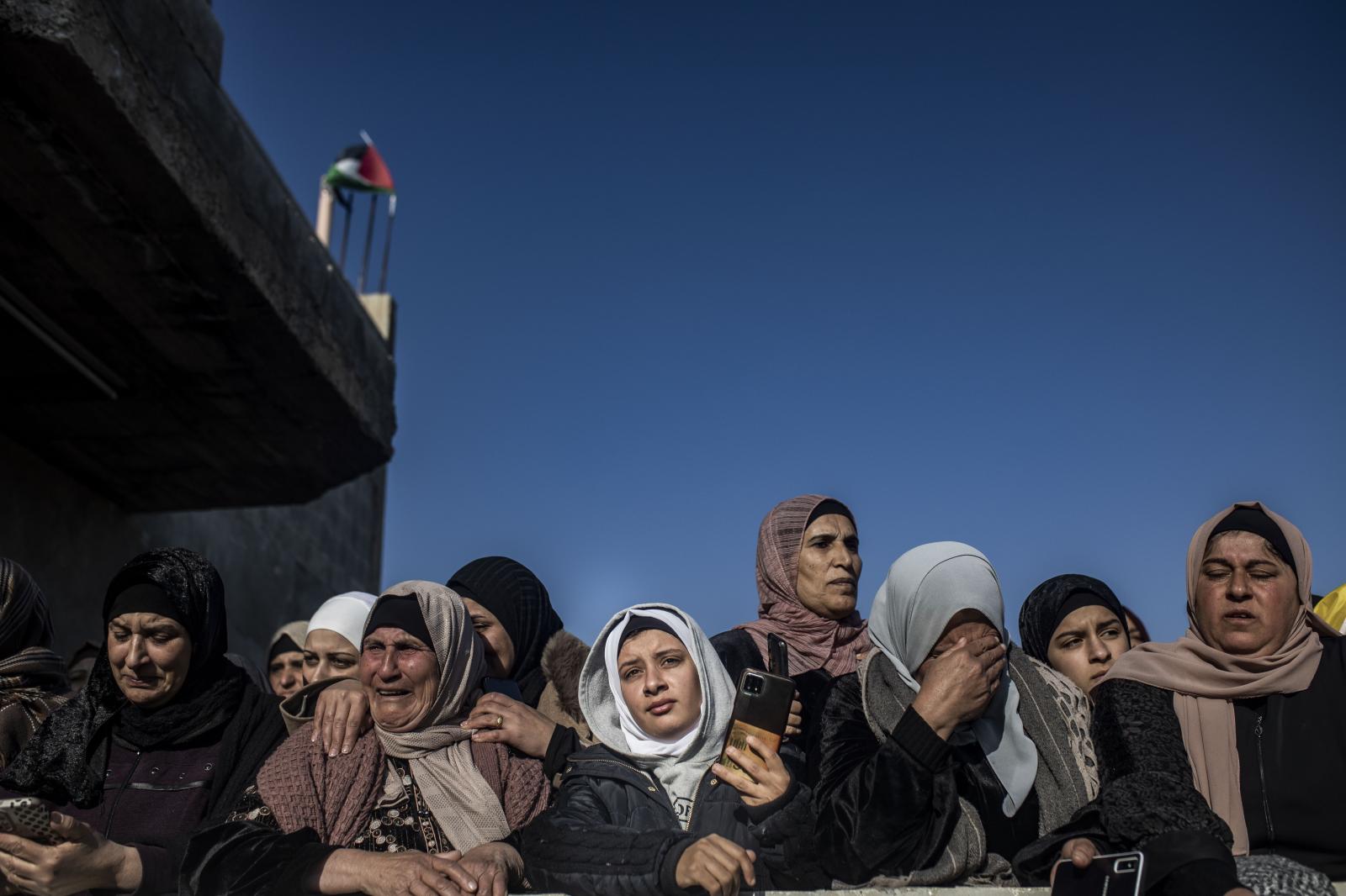 Absent Innocence - Relatives of Ammar Mofleh mourns at the arrival of his...