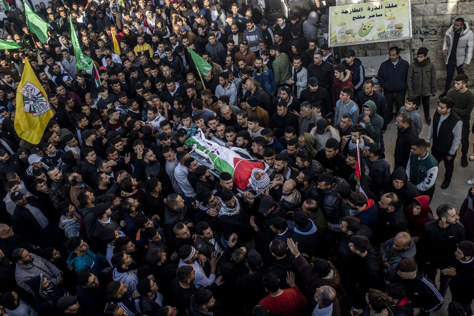Absent Innocence - Palestinians  carry the body of Ammar Mofleh, 22 years...