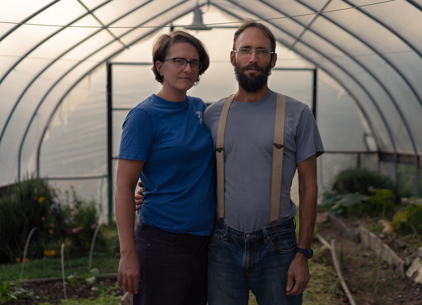 A Spirit of Abundance for Commonweal Magazine - Colleen and Eric Fitts, cofounders of Bethlehem Farm, stand in the hoop house where vegetables...