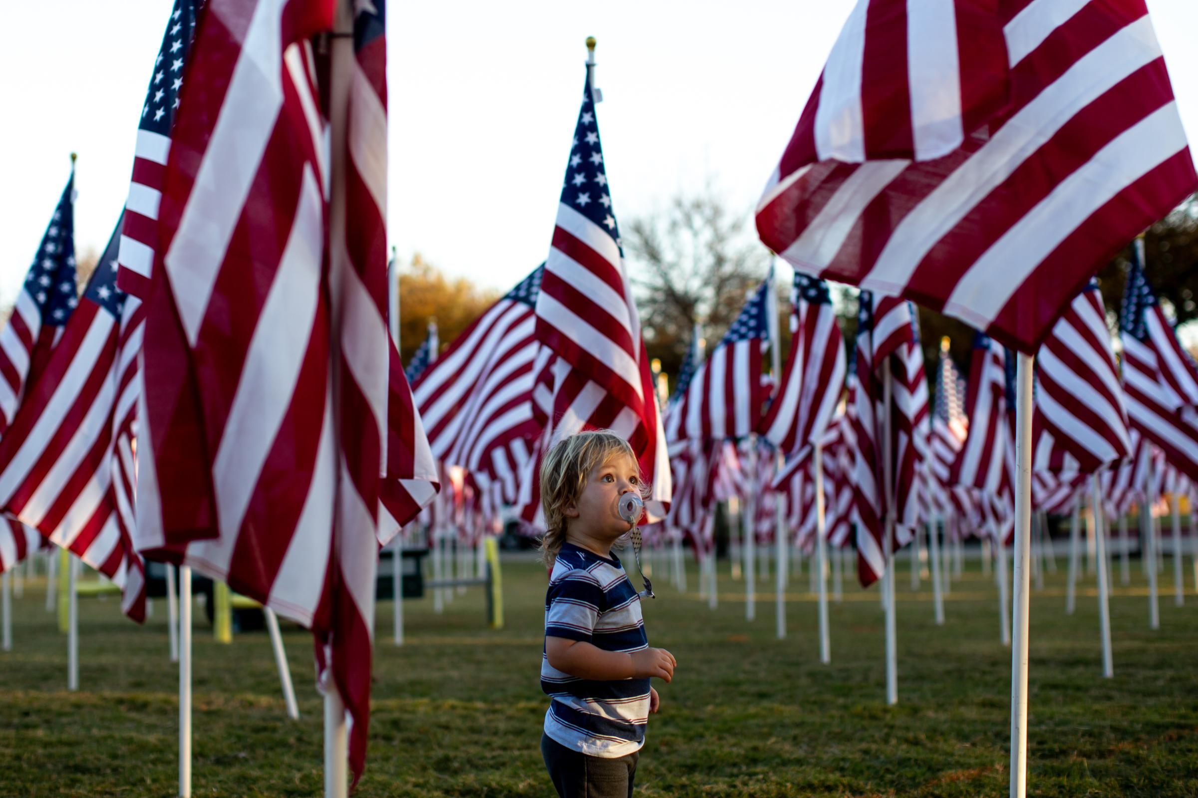 NEWS - 11/9/20KellerTexas - A young boy looks up at an American...