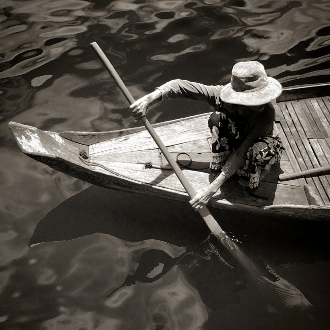  A woman from a floating villag... the Mekong River in Cambodia. 