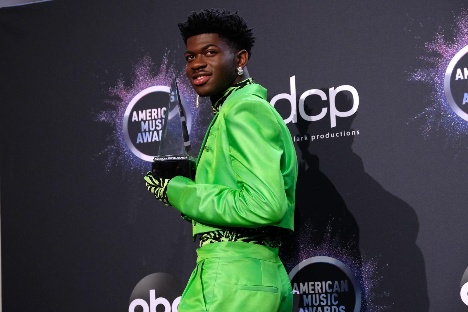 Image from RED CARPET I CELEBRITY - LOS ANGELES, CALIFORNIA - NOVEMBER 24: Lil Nas X poses in...