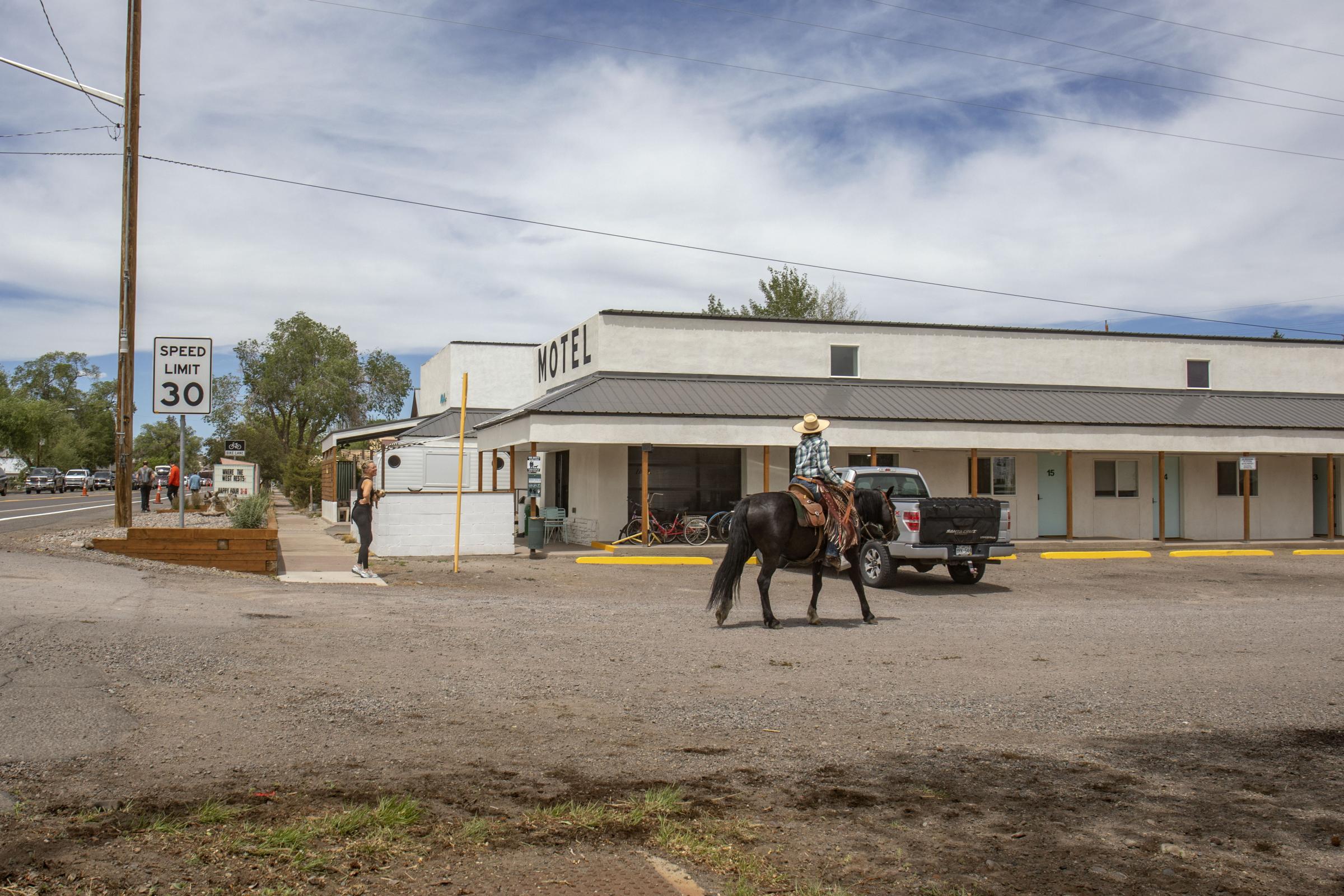 Crisis on the Rio Grande - Emily Brown riding through downtown Monte Vista during the cattle drive. (Photo by Diana...