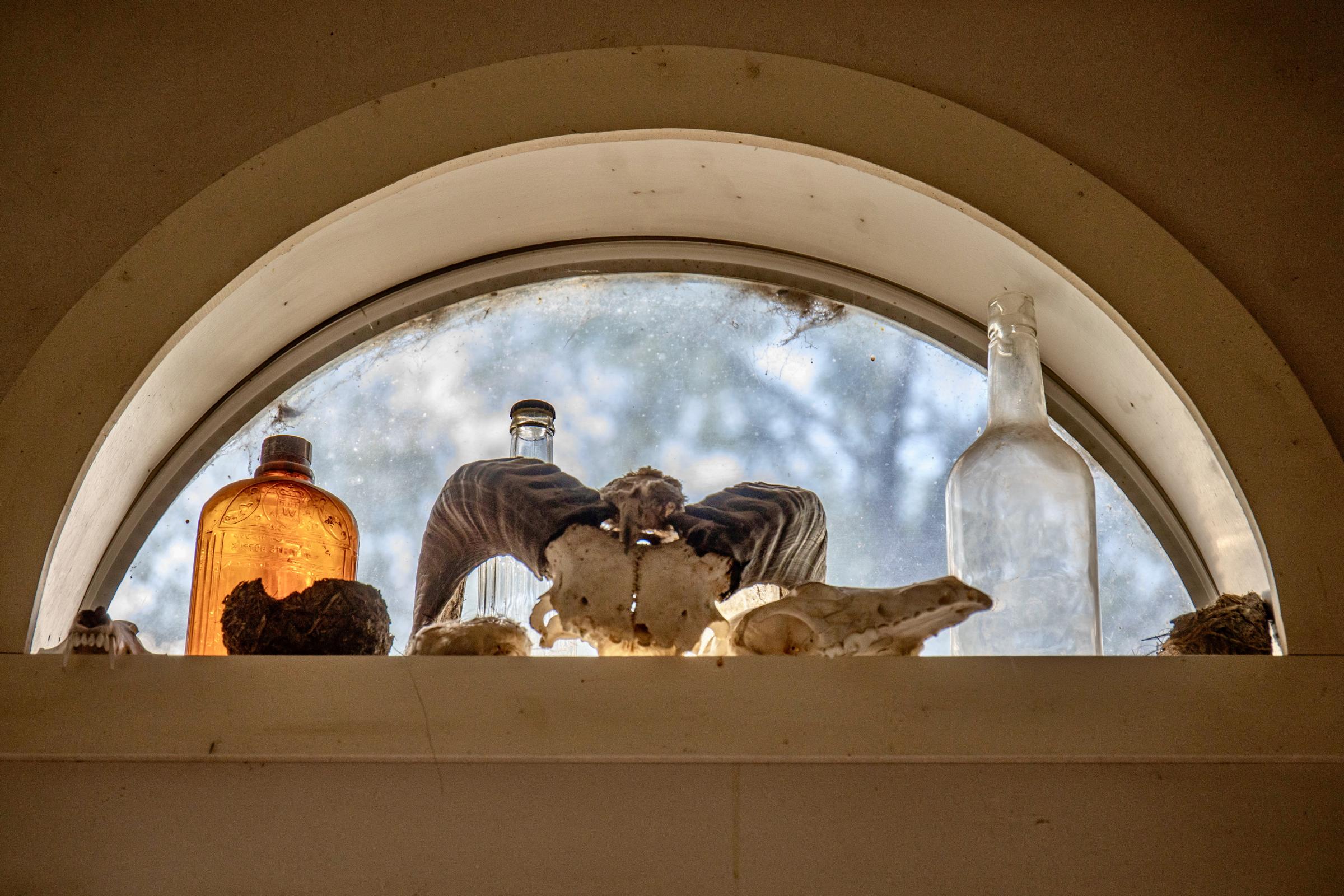 Crisis on the Rio Grande - A collection of items in Schoonover&rsquo;s kitchen window. (Photo by Diana Cervantes for...