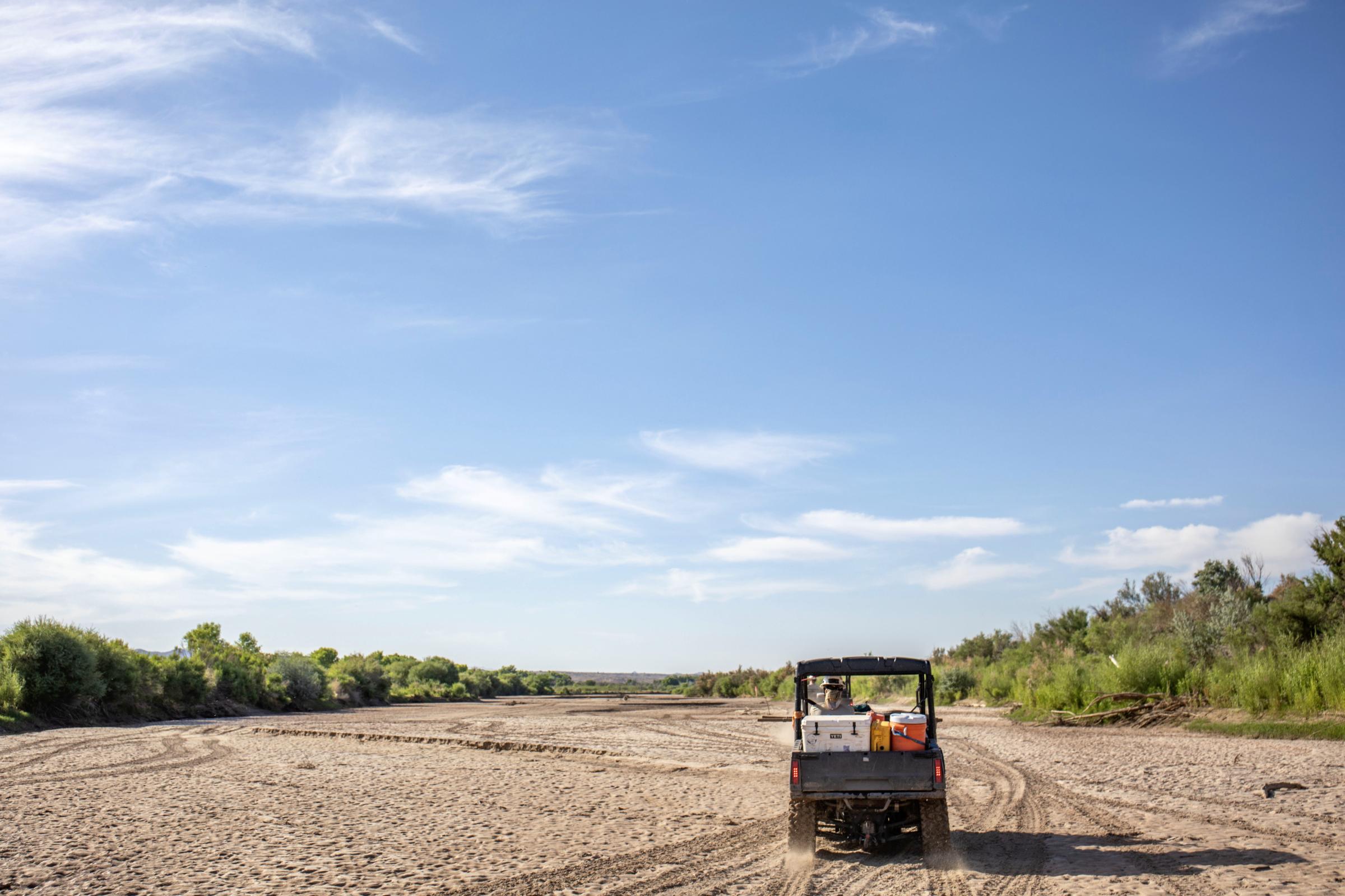 Crisis on the Rio Grande - A vehicle in the dry riverbed of the Rio Grande. The San Acacia Reach is a stretch of the Rio...