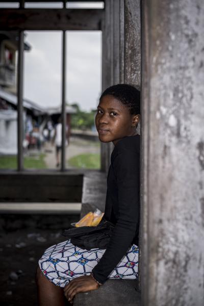Image from Unusual Niger Delta - Portrait of a young fruit vendor in Marine base...