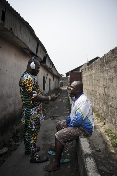Unusual Niger Delta - Prince Nosa, a Chicoco reporter interviews a resident of...