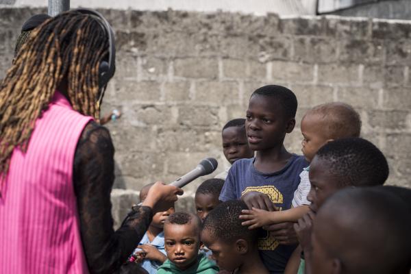 Image from Unusual Niger Delta - Victoria,  a Chicoco reporter interviews some children in...