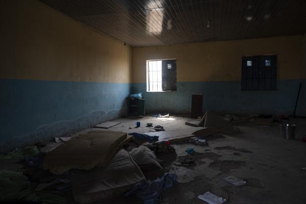 The Negotiator - An empty dormitory with some student items is seen in the...