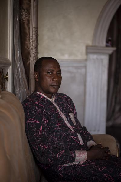 The Negotiator - Mr Sani, 48, sits for a portrait in his house in Kaduna...