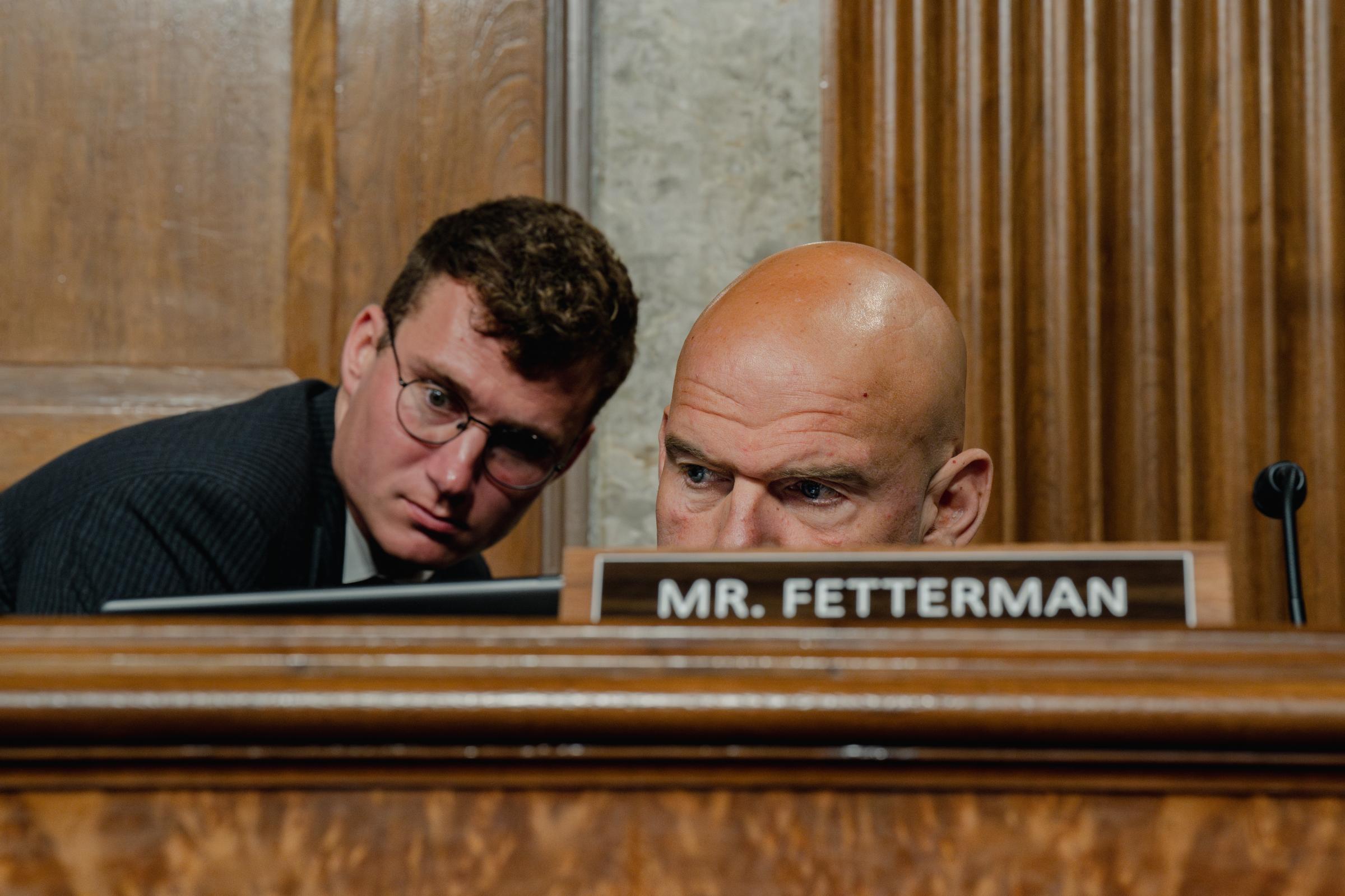 How John Fetterman Came Out of the Darkness -  U.S. Senator John Fetterman (D-PA) uses a device to read...