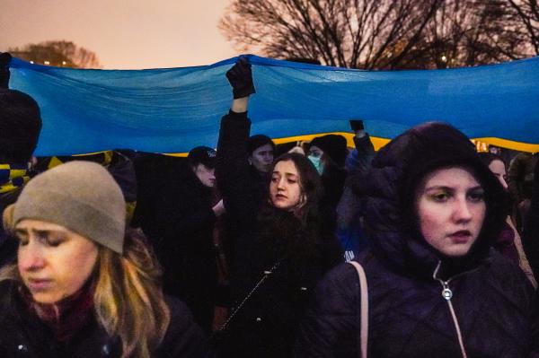Image from Politics Singles -  Demonstrators hold a #Stand With Ukraine protest against...
