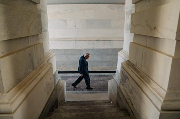 Image from Politics Singles -  U.S. Senator Chuck Schumer (D-NY) walks alone back to...