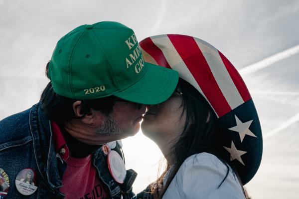 Image from Politics Singles -  Supporters of former U.S. President Donald Trump kiss...