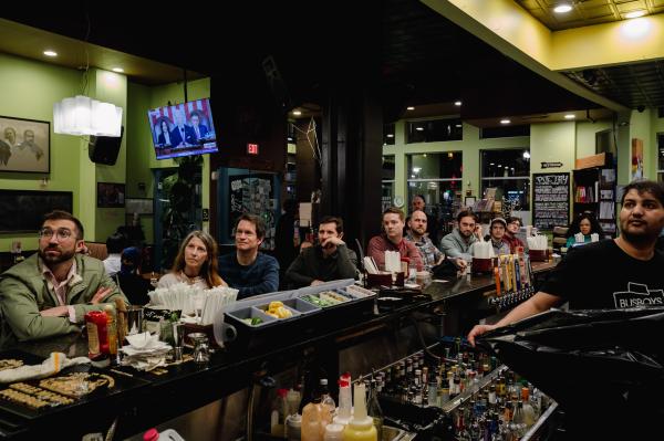 Image from The 2024 State of the Union Address -  People watch the State of the Union Address at Busboy...