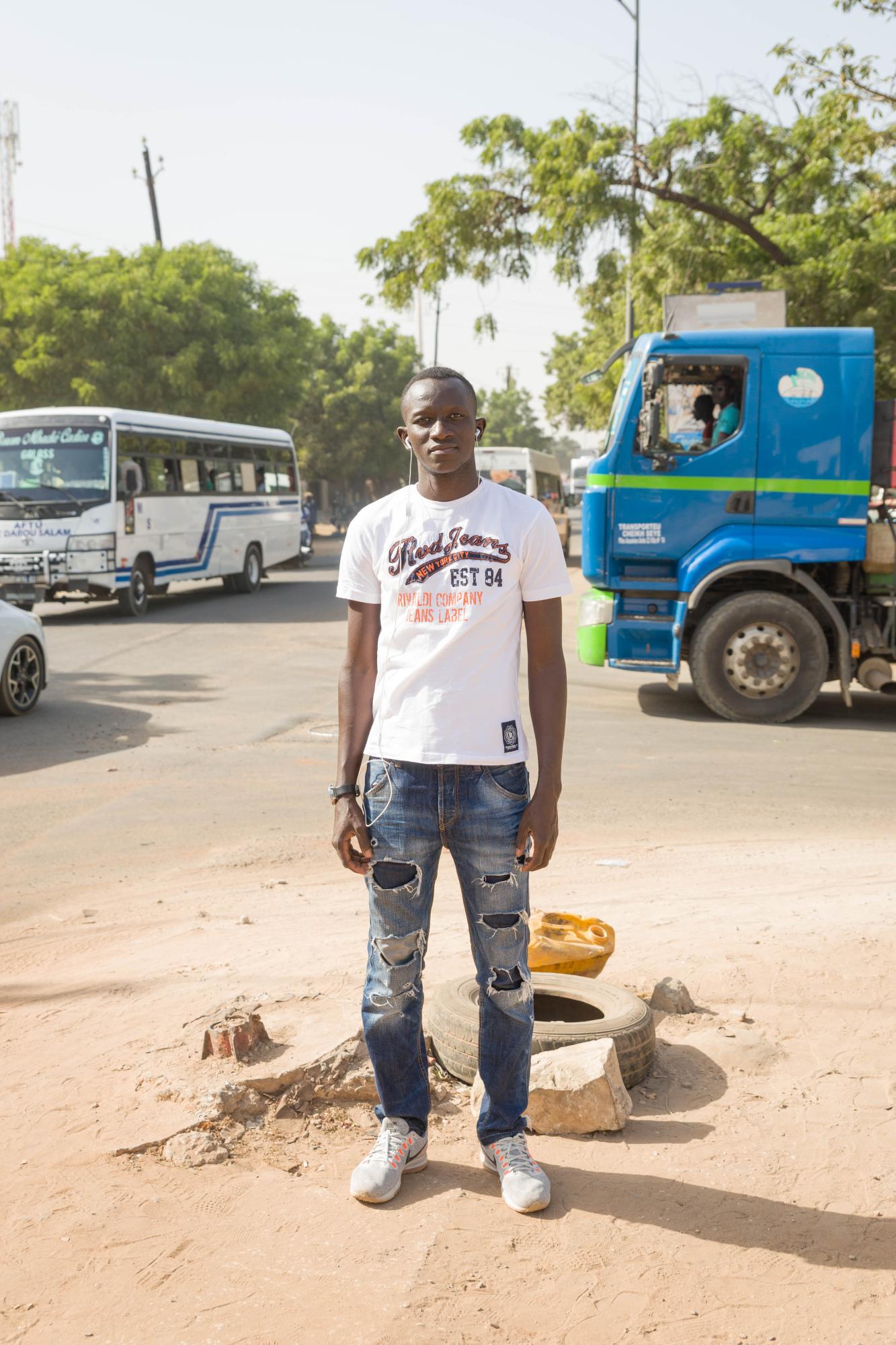 // Olal kanoraku - Ousman Thiaw (34) poses in the Mariste neighborhood of...