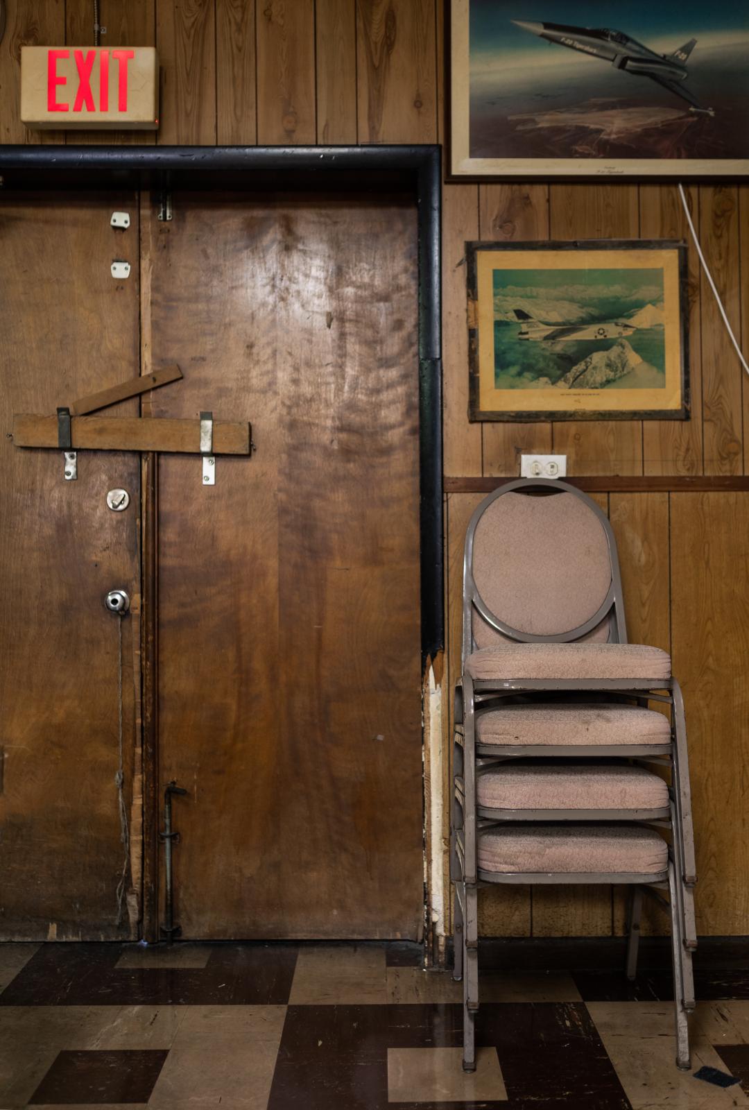 Post 67: American Legion, American Stories - The double doors in the meeting room stay boarded up unless there is a special occasion.