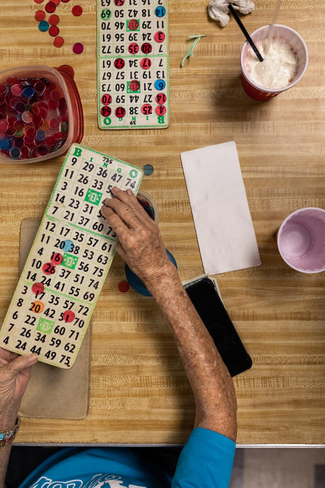 Post 67 - The bingo tables are scattered with drinks, snacks and good luck charms. &nbsp;