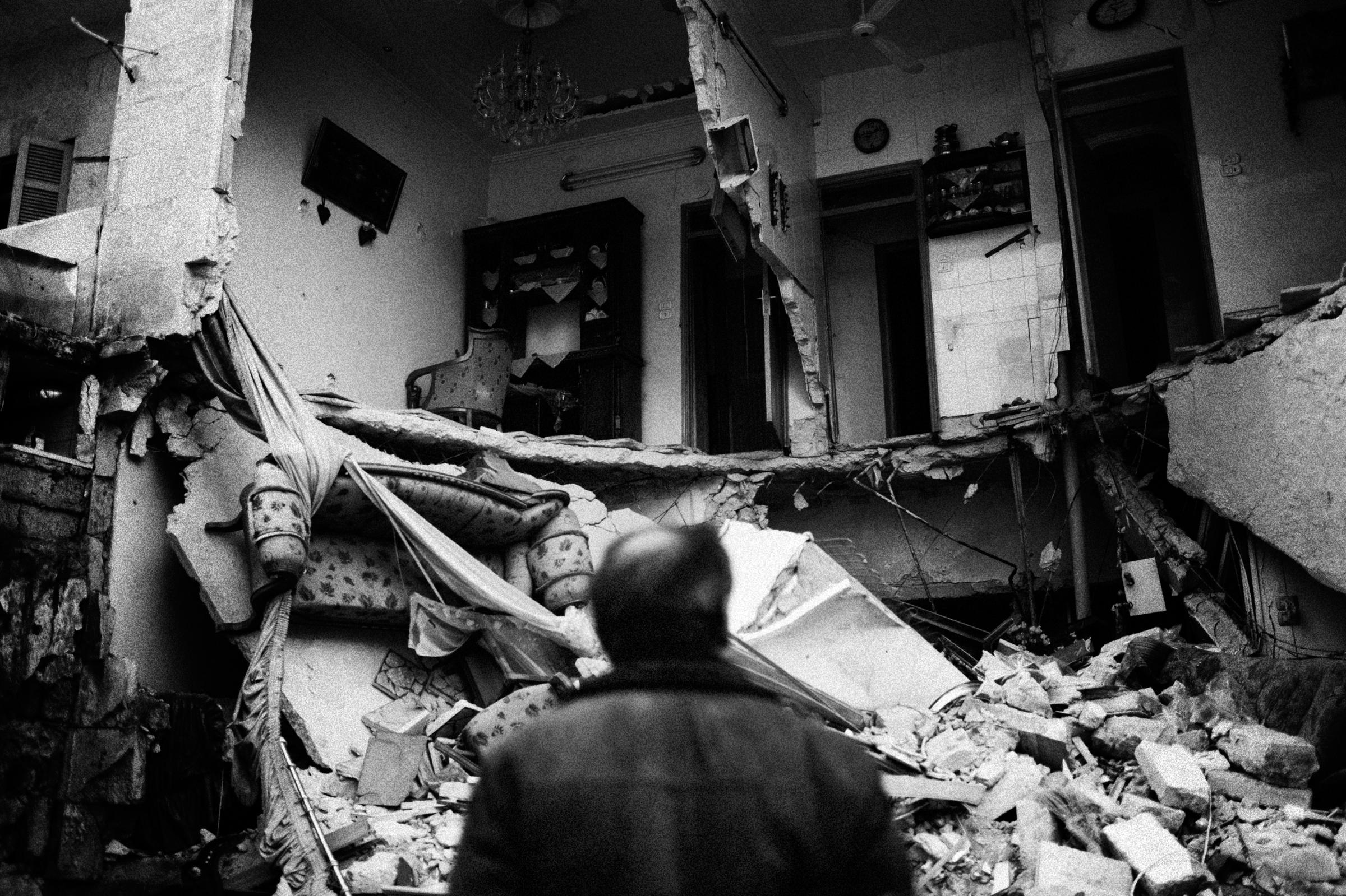 Alepo Scaring Frontlines - A man watching his destroyed house in Izaah neighborhood...
