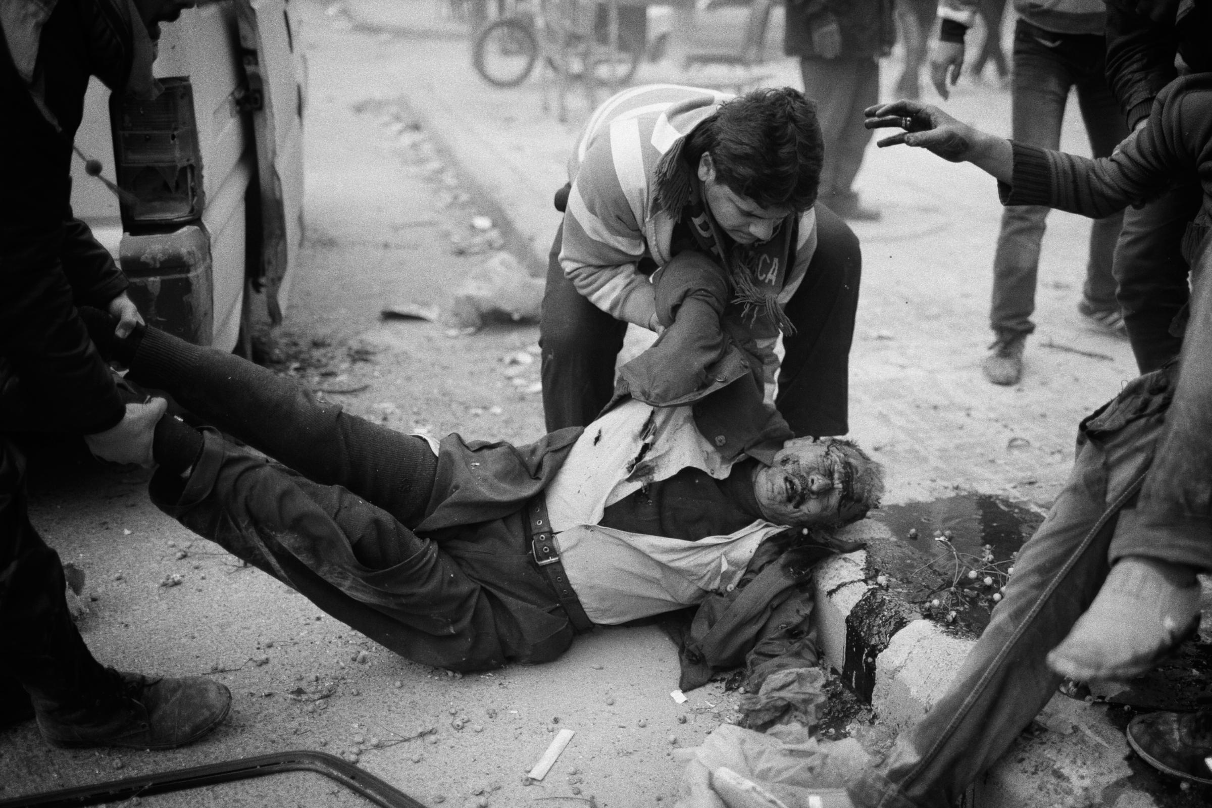Alepo Scaring Frontlines - A civilian lying on the floor after a mortar hits in the...