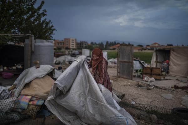  NRC: Syrian stateless in Lebanon - On May 5th, 2023, Yazi, 45, a Syrian refugee from Raqqa tries to rebuild her tent near Marj,...