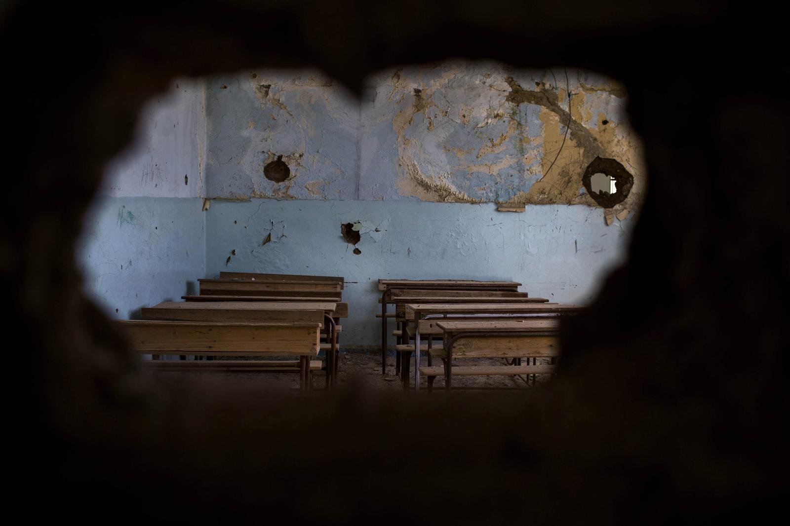 Thumbnail of A view of a destroyed classroom,_ attacked it in July 2015. Syria