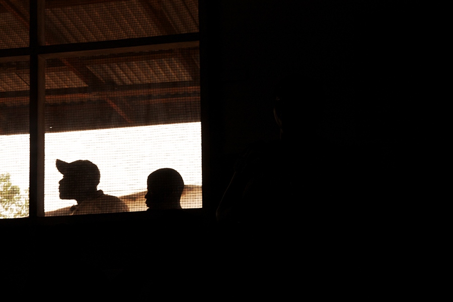 Child rape in Liberia -    Men peak in through the window of Red Cross training...