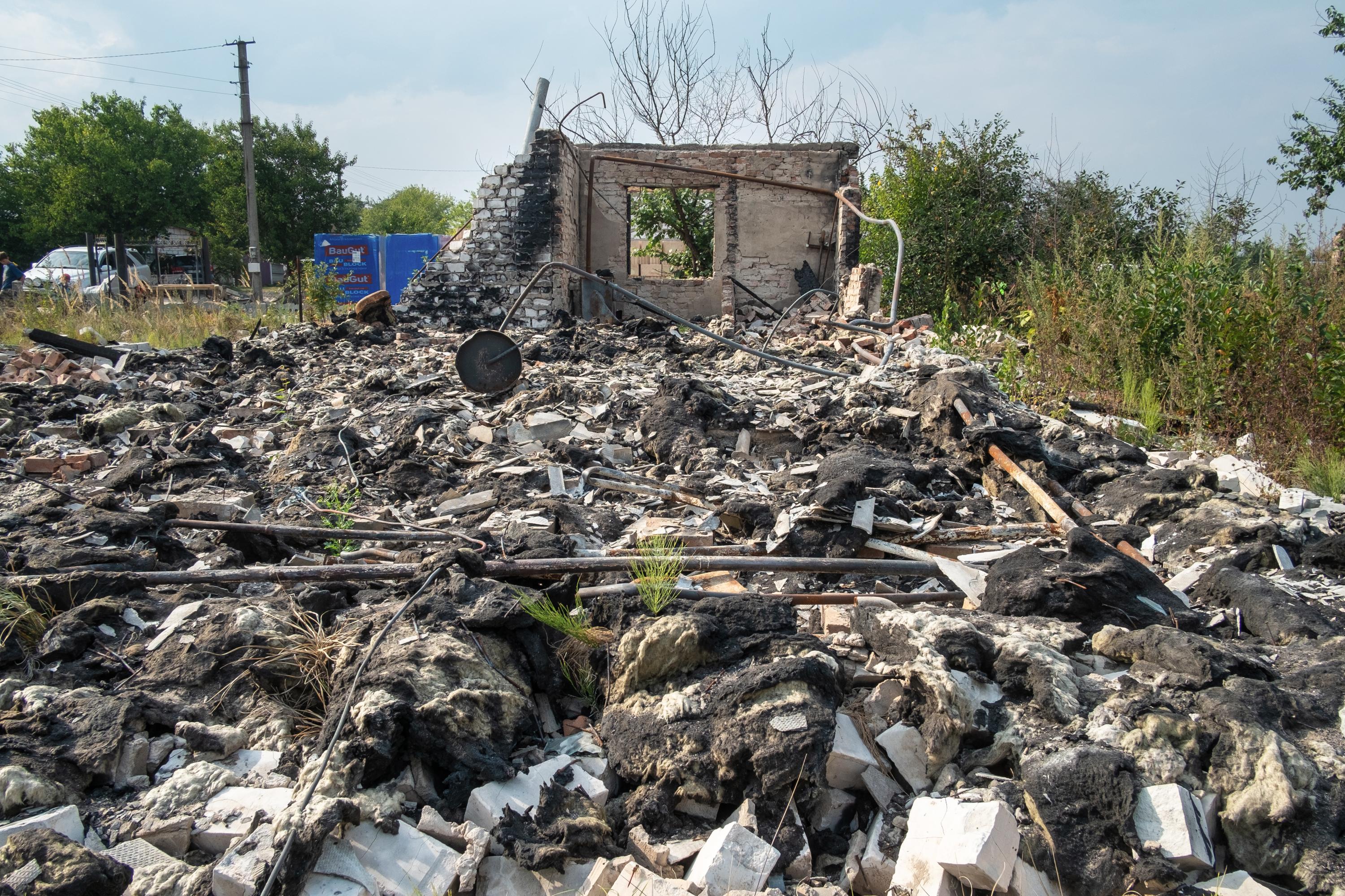 THE RETURN OF VIKA -   Building destroyed in the neighbourhood.  