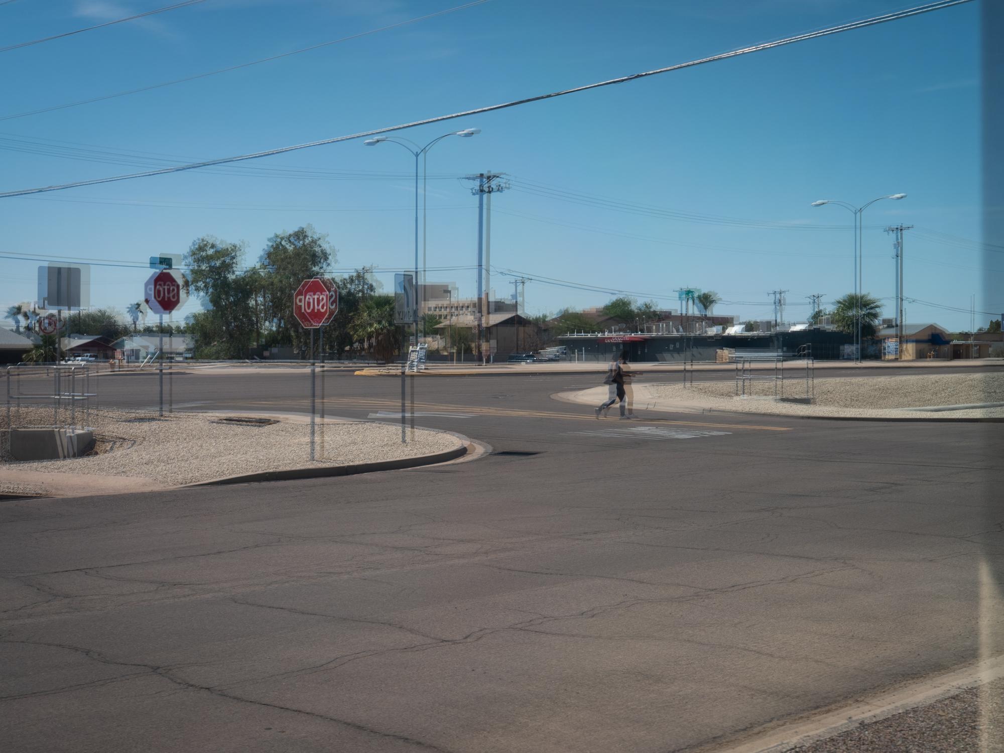 New Arizonans - HuffPost - A surreal streetscape is revealed in the reflection on a...