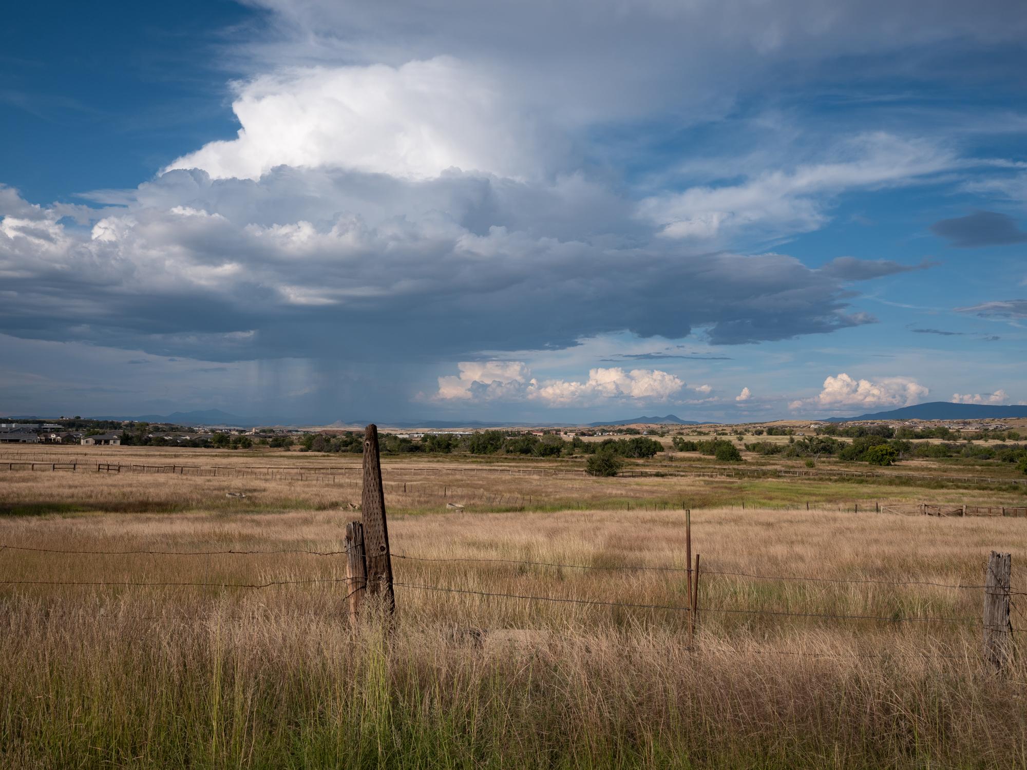 New Arizonans - HuffPost - A roadside view with a distant rainstorm outside...