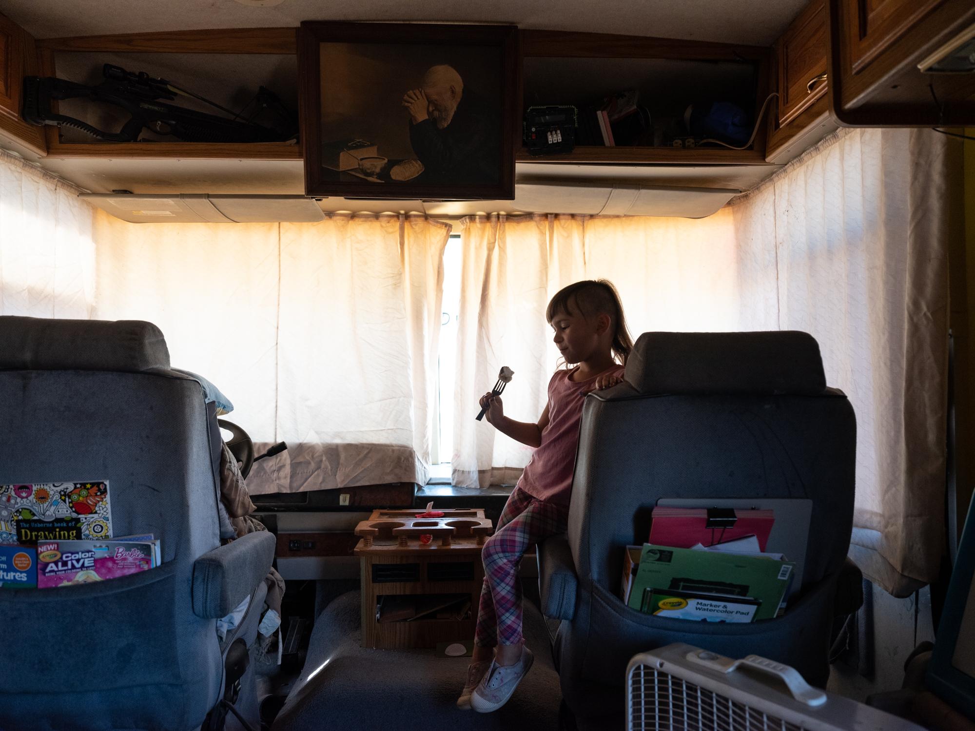 New Arizonans - HuffPost - Lilith Geddis snacks on a marshmallow in the RV where she...