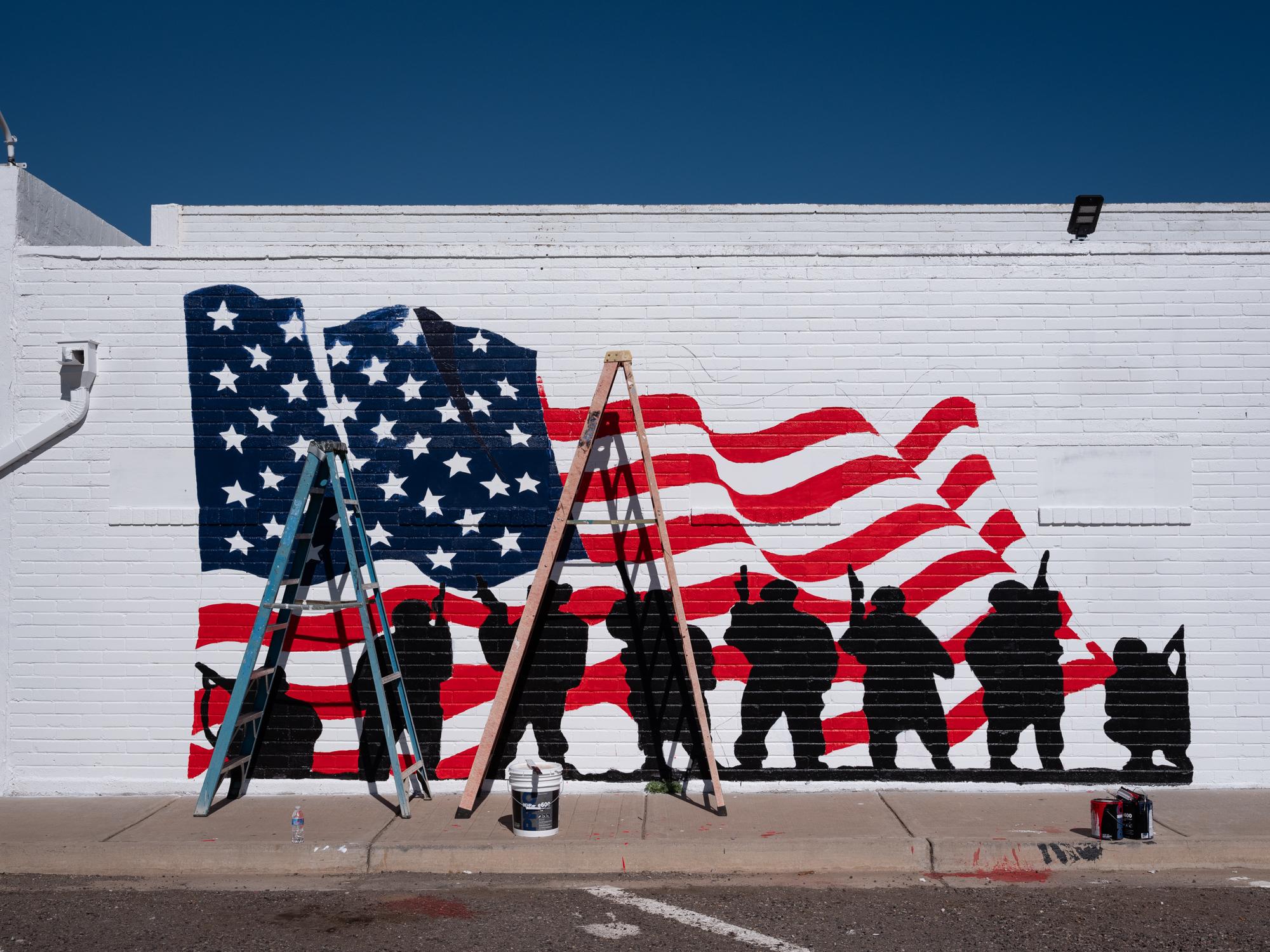 Social Media Migrant Smuggling - Bloomberg Businessweek - Mural in progress at the American Legion Post 11 in...