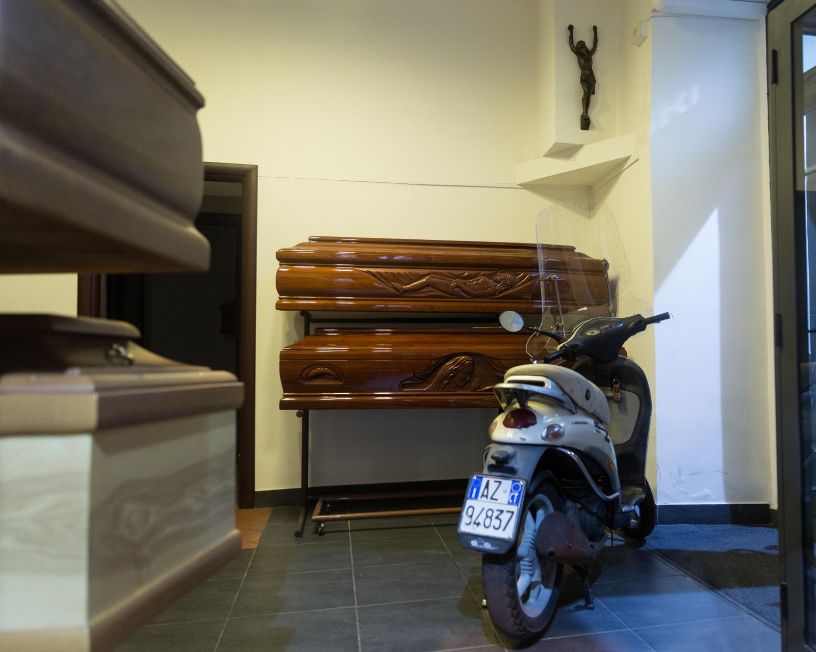 Scooter, Coffins, and Crucifix.