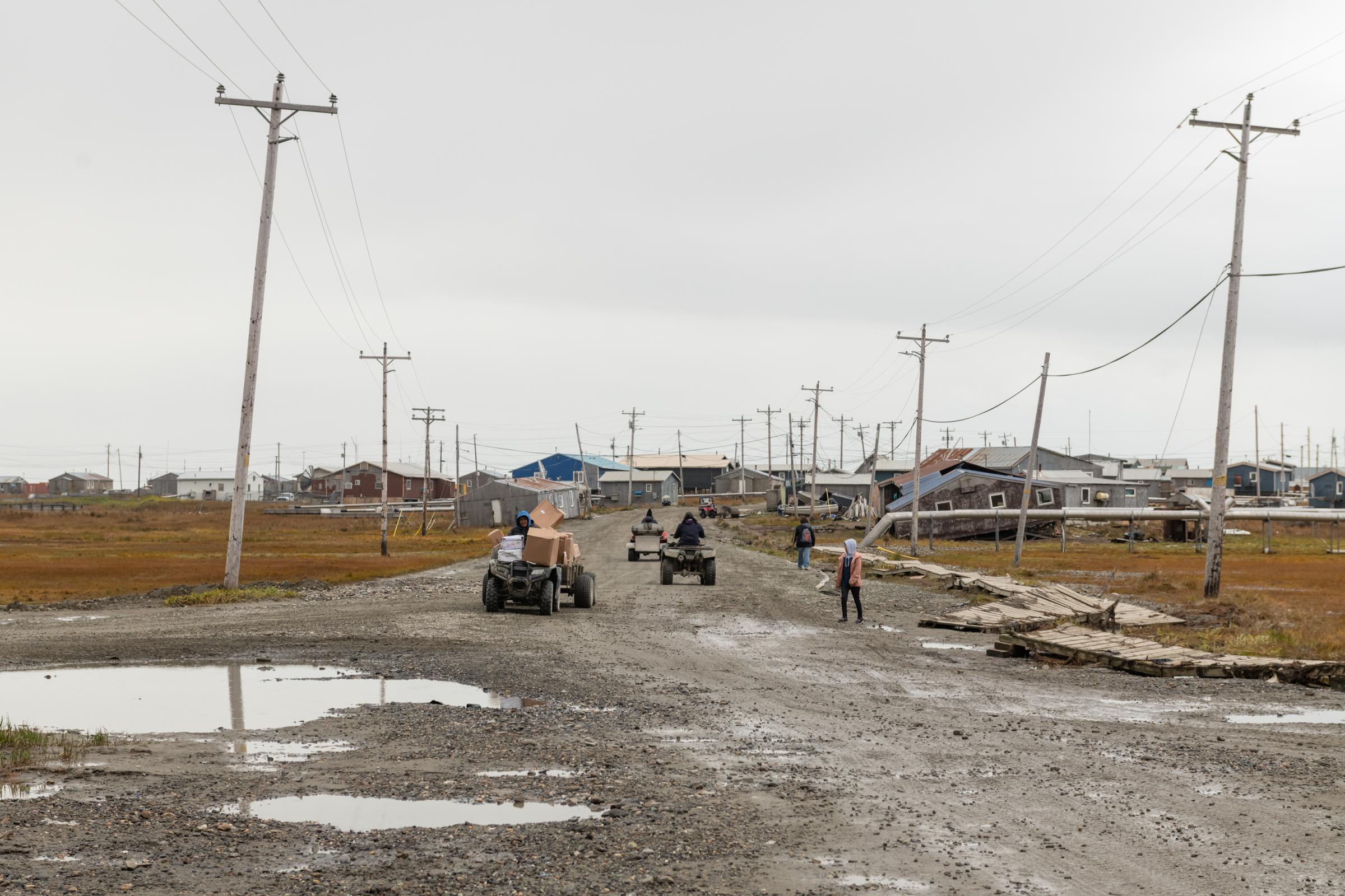Climate Change Comes for the Freezers - The New York Times - All-terrain vehicles fill Airport Street in Hooper Bay,...