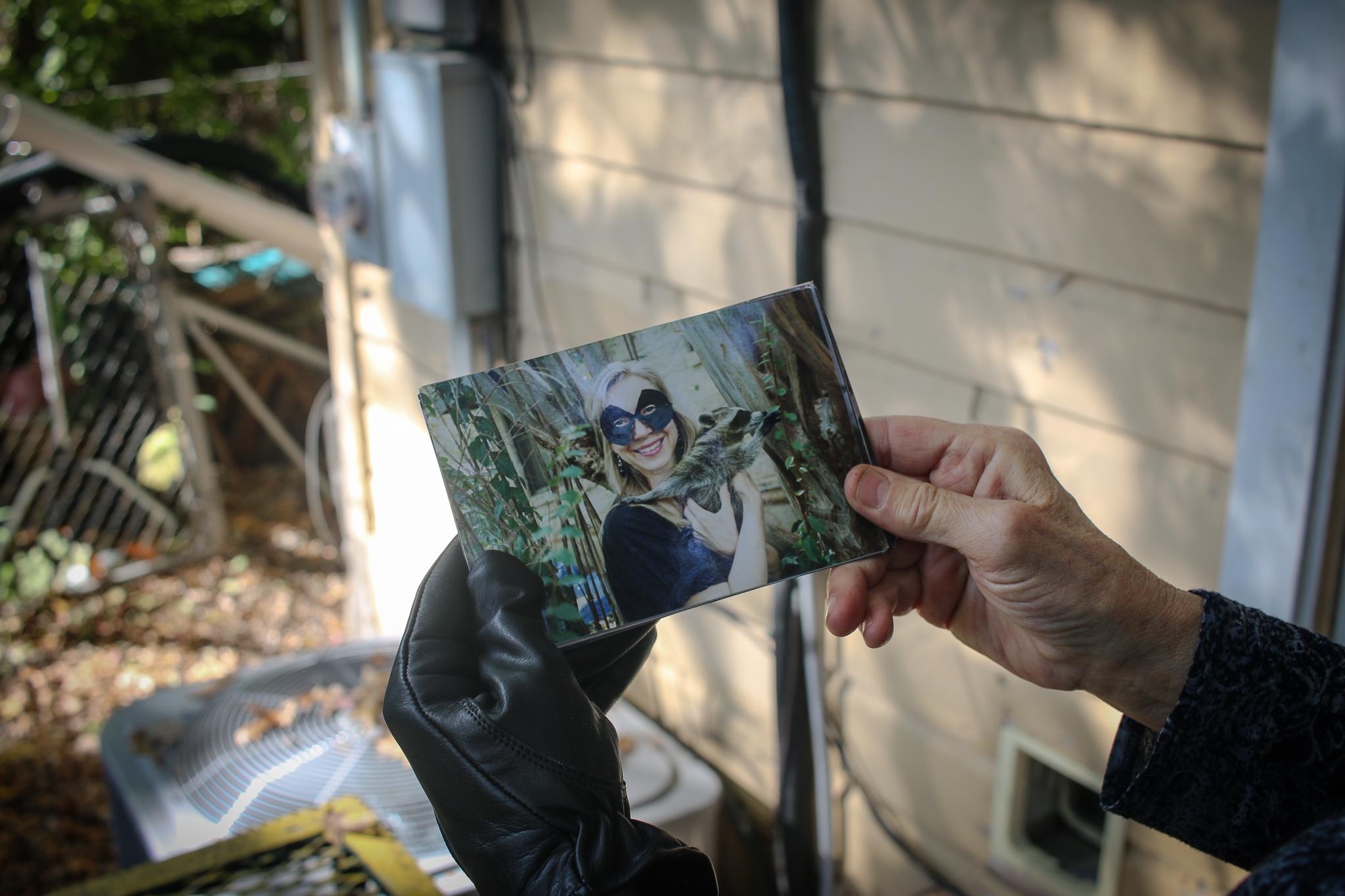 Bat Refuge - Dianne Odegard holds an old photo from when she...