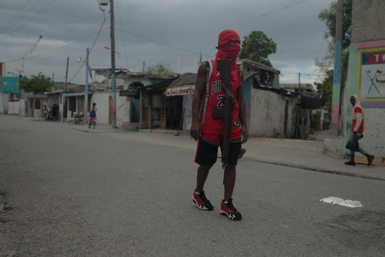 An armed solider stands guard a... Delmas 4. Port-au-Prince Haiti