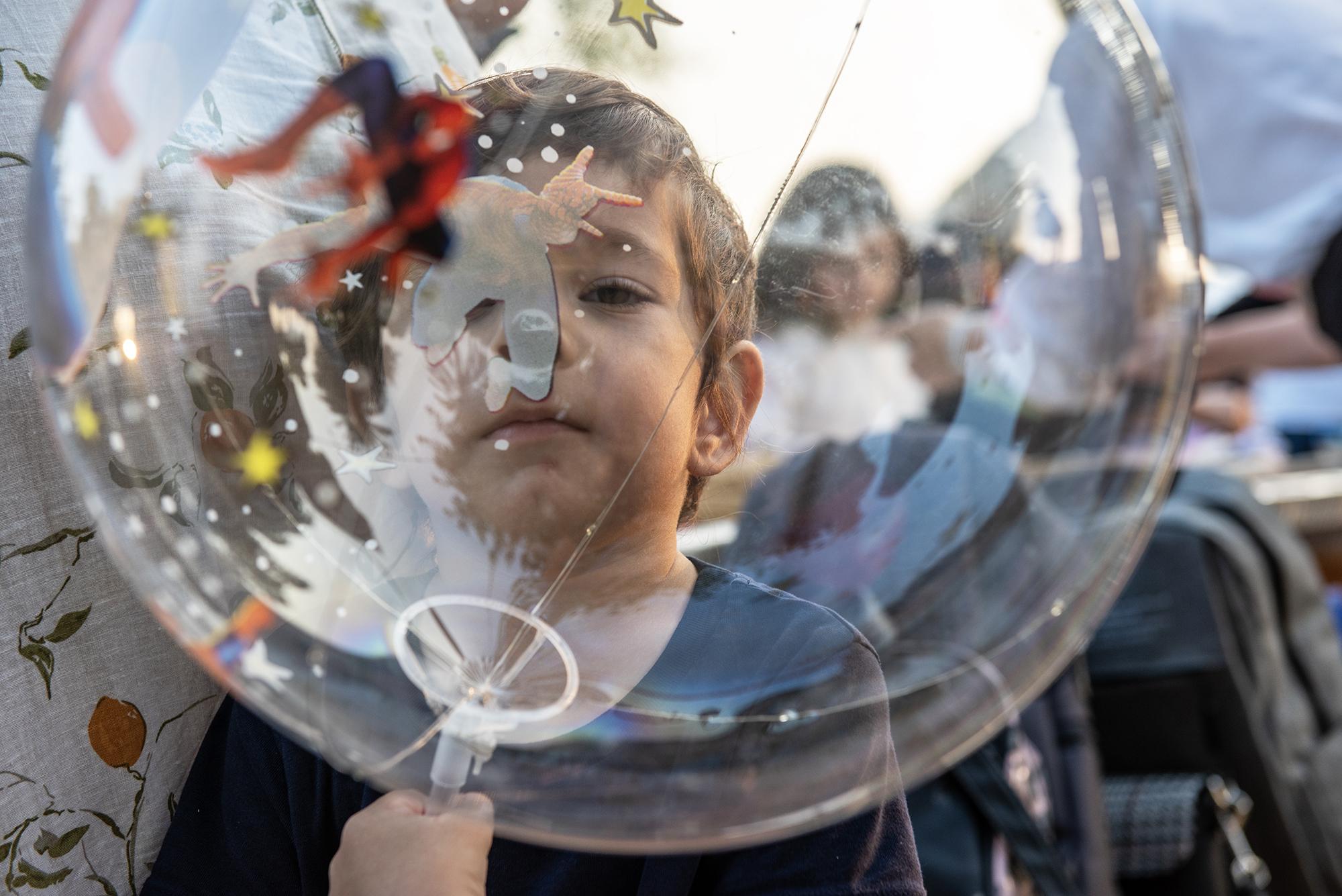 A child plays with his balloon during the Christmas celebrations of the Ukrainian community in Abu Dhabi, Vidhyaa Chandramohan, for The National. 
