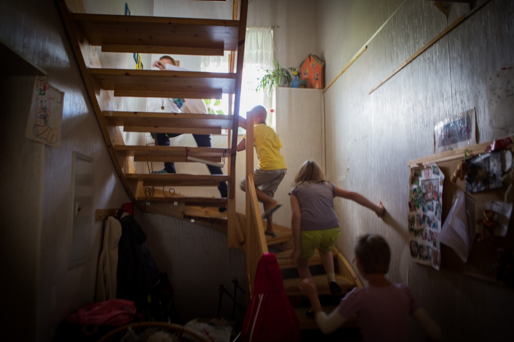 Mother for Hire -  The five Patoka children run upstairs to play in their...